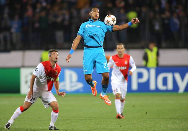 ST PETERSBURG, RUSSIA. OCTOBER 1, 2014. Monacoâ€™s Jeremy Toulalan jumps for the ball past Zenitâ€™s Jose Salomon Rondon Gimenez (R) in their UEFA Champions League Round 2 Group C football match with Monaco at Petrovsky Stadium. The game ended in a 0-0 draw. RuslanxShamukov TASS  RE150BC1