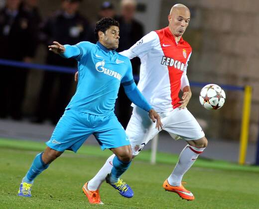 ST PETERSBURG, RUSSIA. OCTOBER 1, 2014. Zenitâ€™s Hulk and Monaco s Andrea Raggi (R) fight for the ball in their UEFA Champions League Round 2 Group C football match at Petrovsky Stadium. The game ended in a 0-0 draw. RuslanxShamukov TASS  RE150BC3