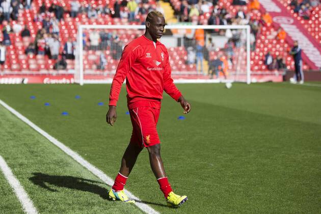 Mario Balotelli of Liverpool strolls out for warm up - Liverpool vs. West Bromwich Albion - Barclay s Premier League - Anfield - Liverpool - 04 10 2014 Pic Philip Oldham Sportimage EDITORIAL USE ONLY. No use with unauthorised audio, video, data, fixture lists, club league logos or live services. Online in-match use limited to 120 images, no video emulation. No use in betting, games or single club league player publications.