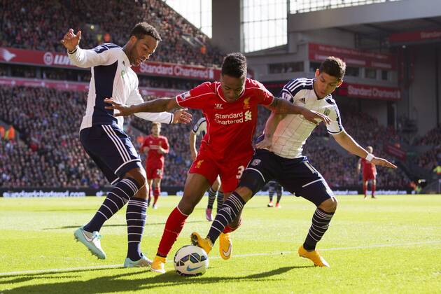 Raheem Sterling of Liverpool battles West Brom s Joleon Loscott and Cristian Gamboa - Liverpool vs. West Bromwich Albion - Barclay s Premier League - Anfield - Liverpool - 04 10 2014 Pic Philip Oldham Sportimage EDITORIAL USE ONLY. No use with unauthorised audio, video, data, fixture lists, club league logos or live services. Online in-match use limited to 120 images, no video emulation. No use in betting, games or single club league player publications.
