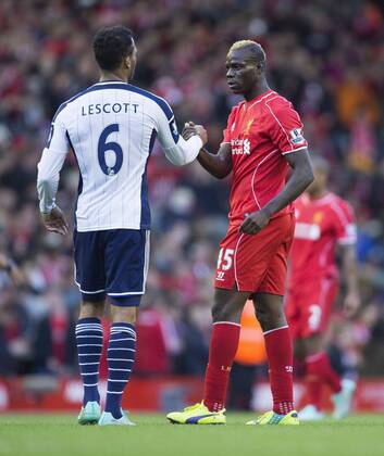 West Brom s Joleon Loscott congratulates Mario Balotelli of Liverpool at full time - Liverpool FC vs. West Bromwich Albion - Barclay s Premier League - Anfield - Liverpool - 04 10 2014 Pic PhilipxOldham Sportimage EDITORIAL USE ONLY. No use with unauthorised audio, video, data, fixture lists, club league logos or live services. Online in-match use limited to 120 images, no video emulation. No use in betting, games or single club league player publications.