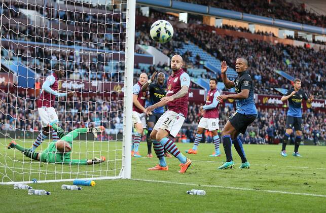 Relief for Villa and despair for Manchester City as Edin Dzeko of Manchester City header is deflected wide by Aly Cissokho of Aston Villa - Barclays Premier League - Aston Villa vs Manchester City - - England - 4th October 2014 - Picture SimonxBellis Sportimage EDITORIAL USE ONLY. No use with unauthorised audio, video, data, fixture lists, club league logos or live services. Online in-match use limited to 120 images, no video emulation. No use in betting, games or single club league player publications.