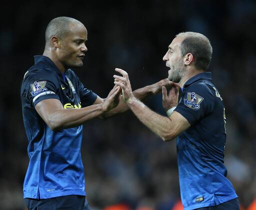 Vincent Kompany of Manchester City and Pablo Zabaleta of Manchester City celebrate the win - Barclays Premier League - Aston Villa vs Manchester City - - England - 4th October 2014 - Picture SimonxBellis Sportimage EDITORIAL USE ONLY. No use with unauthorised audio, video, data, fixture lists, club league logos or live services. Online in-match use limited to 120 images, no video emulation. No use in betting, games or single club league player publications.