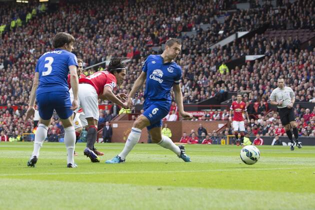 Radamel Falcao of Manchester United gets an early header at goal - Manchester United vs. Everton - Barclay s Premier League - Old Trafford - Manchester - 04 10 2014 Pic Philip Oldham Sportimage EDITORIAL USE ONLY. No use with unauthorised audio, video, data, fixture lists, club league logos or live services. Online in-match use limited to 120 images, no video emulation. No use in betting, games or single club league player publications.