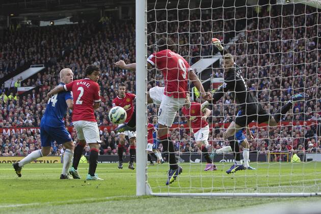 Radamel Falcao of Manchester United clears from the line following a header from Phil Jagielka of Everton - Manchester United vs. Everton - Barclay s Premier League - Old Trafford - Manchester - 04 10 2014 Pic Philip Oldham Sportimage EDITORIAL USE ONLY. No use with unauthorised audio, video, data, fixture lists, club league logos or live services. Online in-match use limited to 120 images, no video emulation. No use in betting, games or single club league player publications.
