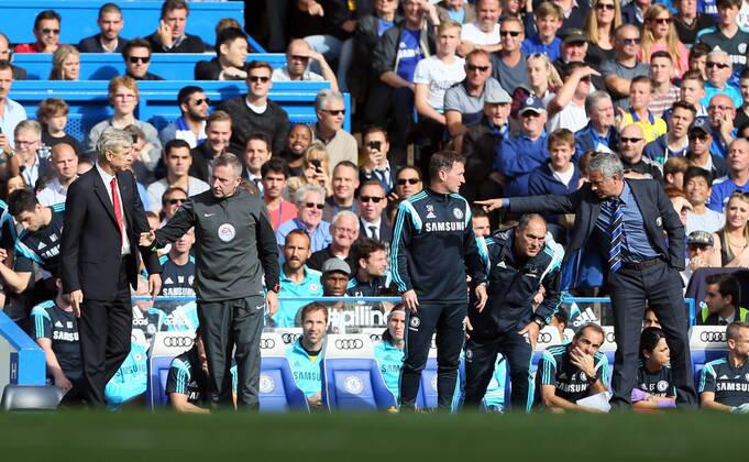 Chelsea s Jose Mourinho and Arsenal s Arsene Wenger square up to each other - Barclays Premier League - Chelsea Vs Arsenal - Stamford Bridge - England - 5th October 2014 - Picture David Klein Sportimage EDITORIAL USE ONLY. No use with unauthorised audio, video, data, fixture lists, club league logos or live services. Online in-match use limited to 120 images, no video emulation. No use in betting, games or single club league player publications.