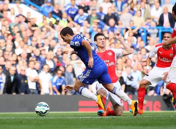 Chelsea s Eden Hazard gets brought down by Arsenal s Laurent Koscielny for a penalty - Barclays Premier League - Chelsea Vs Arsenal - Stamford Bridge - England - 5th October 2014 - Picture David Klein Sportimage EDITORIAL USE ONLY. No use with unauthorised audio, video, data, fixture lists, club league logos or live services. Online in-match use limited to 120 images, no video emulation. No use in betting, games or single club league player publications.