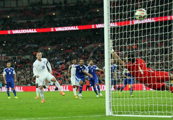 England s Wayne Rooney scoring his sides second goal - Euro 2016 Qualification - England vs San Marino - Wembley Stadium - England - 9th October 2014 - Picture David Klein Sportimage EDITORIAL USE ONLY. No use with unauthorised audio, video, data, fixture lists, club league logos or live services. Online in-match use limited to 120 images, no video emulation. No use in betting, games or single club league player publications.