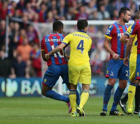 Chelsea s Cesc Fabregas throws Crystal Palace s Frazier Campbell to the ground - Barclays Premier League - Crystal Palace vs FC Chelsea London - Selhurst Park - England - 18th October 2014 - EDITORIAL USE ONLY. No use with unauthorised audio, video, data, fixture lists, club league logos or live services. Online in-match use limited to 120 images, no video emulation. No use in betting, games or single club league player publications.