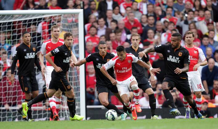 Arsenal v Hull City . . London, UK . . 18.10.2014 Hull players surround Alexis Sanchez (A) 