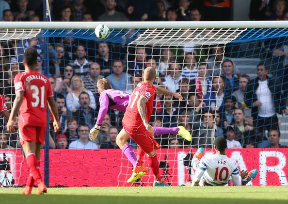 QPR s Leroy Fer watches as his header hits the bar - Barclays Premier League - QPR vs Liverpool - Loftus Road - England - 19th October 2014 - Picture David Klein Sportimage EDITORIAL USE ONLY. No use with unauthorised audio, video, data, fixture lists, club league logos or live services. Online in-match use limited to 120 images, no video emulation. No use in betting, games or single club league player publications.
