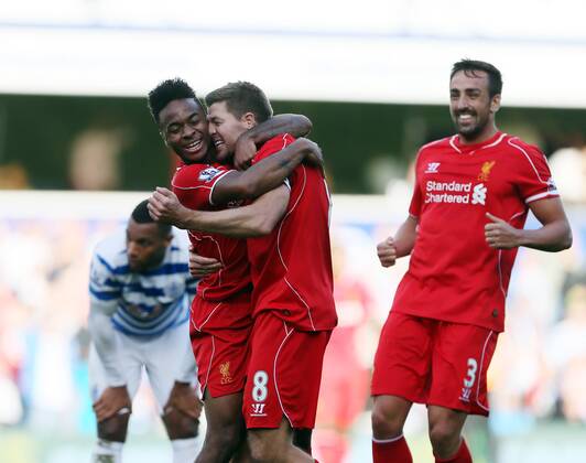 Liverpool s Raheem Sterling celebrates his sides winning goal with Steven Gerrard - Barclays Premier League - QPR vs Liverpool - Loftus Road - England - 19th October 2014 - Picture David Klein Sportimage EDITORIAL USE ONLY. No use with unauthorised audio, video, data, fixture lists, club league logos or live services. Online in-match use limited to 120 images, no video emulation. No use in betting, games or single club league player publications.