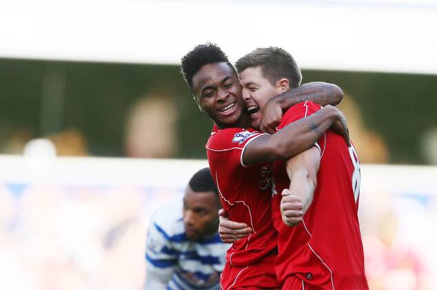Liverpool s Raheem Sterling celebrates his sides winning goal with Steven Gerrard - Barclays Premier League - QPR vs Liverpool - Loftus Road - England - 19th October 2014 - Picture David Klein Sportimage EDITORIAL USE ONLY. No use with unauthorised audio, video, data, fixture lists, club league logos or live services. Online in-match use limited to 120 images, no video emulation. No use in betting, games or single club league player publications.