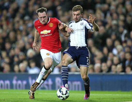 Phil Jones of Manchester United tussles with James Morrison of West Bromwich Albion - Barclays Premier League - WBA vs Manchester Utd - Hawthorns Stadium - West Bromwich - England - 20th October 2014 - Picture Simon Bellis Sportimage EDITORIAL USE ONLY. No use with unauthorised audio, video, data, fixture lists, club league logos or live services. Online in-match use limited to 120 images, no video emulation. No use in betting, games or single club league player publications.