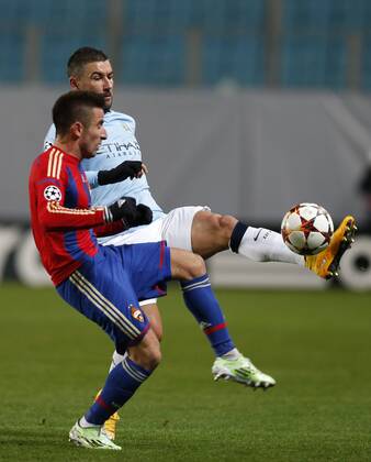 MOSCOW REGION, RUSSIA. OCTOBER 21, 2014. CSKA s Zoran Tosic (L) and Manchester City s Aleksandar Kolarov fight for the ball in their 2014 15 Season UEFA Champions League Group E Round 3 football match at Arena Khimki Stadium. The game is played behind closed doors as CSKA have been punished for their fans poor behavior. Mikhail Japaridze TASS  premiumd 20143657