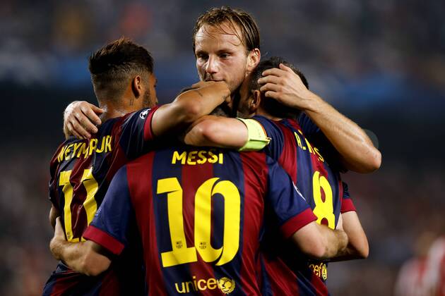 BARCELONA, Oct. 21, 2014 -- Barcelona s Lionel Messi celebrates scoring with teammates during the UEFA Champions League football match against Ajax Amsterdam in Barcelona, Spain, Oct. 21, 2014. Barcelona won 3-1. ) (SP)SPAIN-BARCELONA-UEFA-AJAX PauxBarrena 