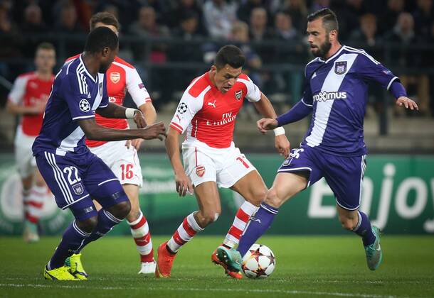 - BRUSSELS, BELGIUM: Anderlecht s Chancel Mbemba, Arsenal s Alexis Sanchez and Anderlecht s Steven Defour fight for the ball during a third group stage game between RSCA Anderlecht and English team Arsenal, in the group D of the UEFA Champions League competition, Wednesday 22 October 2014. VIRGINIExLEFOUR  premiumd 20144949