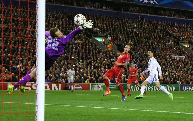 Cristiano Ronaldo of Real Madrid scores the first goal past Simon Mignolet of Liverpool - UEFA Champions League Group B - Liverpool vs Real Madrid - Anfield Stadium - Liverpool- England - 22nd October 2014 - Picture Simon Bellis Sportimage EDITORIAL USE ONLY. No use with unauthorised audio, video, data, fixture lists, club league logos or live services. Online in-match use limited to 120 images, no video emulation. No use in betting, games or single club league player publications.
