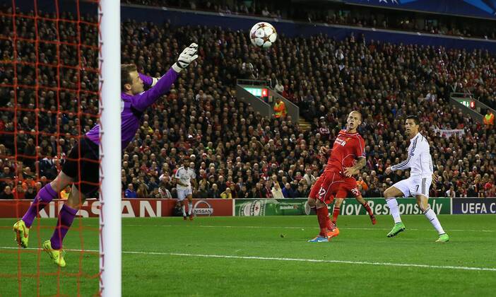 Cristiano Ronaldo of Real Madrid scores the first goal past Simon Mignolet of Liverpool - UEFA Champions League Group B - Liverpool vs Real Madrid - Anfield Stadium - Liverpool- England - 22nd October 2014 - Picture Simon Bellis Sportimage EDITORIAL USE ONLY. No use with unauthorised audio, video, data, fixture lists, club league logos or live services. Online in-match use limited to 120 images, no video emulation. No use in betting, games or single club league player publications.