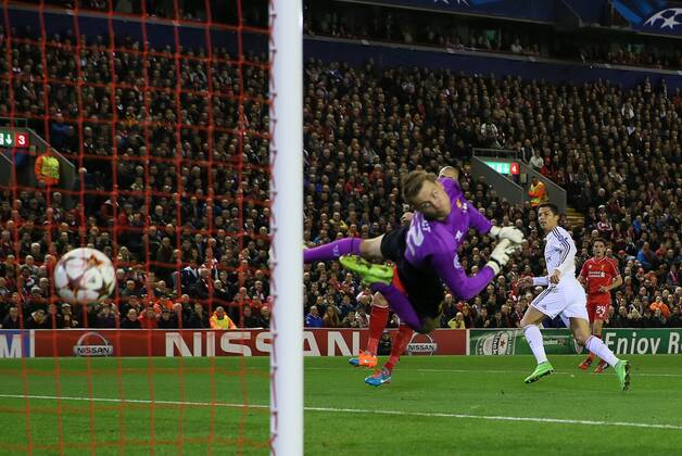 Cristiano Ronaldo of Real Madrid scores the first goal past Simon Mignolet of Liverpool - UEFA Champions League Group B - Liverpool vs Real Madrid - Anfield Stadium - Liverpool- England - 22nd October 2014 - Picture Simon Bellis Sportimage EDITORIAL USE ONLY. No use with unauthorised audio, video, data, fixture lists, club league logos or live services. Online in-match use limited to 120 images, no video emulation. No use in betting, games or single club league player publications.