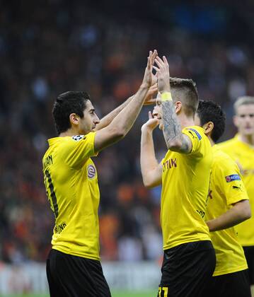 UEFA Champions League Group D match between Galatasaray and Borussia Dortmund at Turk Telekom Arena on October 22, 2014 in Istanbul, Turkey. Pictured: Borussia Dortmund players Marco Reus (R) and Henrikh Mkhitaryan (L) celebrates after goal. 