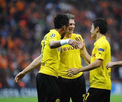 UEFA Champions League Group D match between Galatasaray and Borussia Dortmund at Turk Telekom Arena on October 22, 2014 in Istanbul, Turkey. Pictured: Borussia Dortmund players Pierre Emerick Aubameyang (L) and Lukasz Piszczek (C) and Shinji Kagawa (R) celebrates after their first goal. 