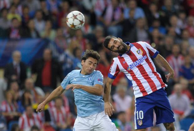 Malmo FF Defender, Ricardinho - RICARDINHO, number 20 . Atletico de Madrid Midfielder, Arda Turan - ARDA, number 10. Round 3 of the CHAMPIONS league, soccer match between Atletico de Madrid - Malmo FF at the Vicente Calderon stadium, Madrid - Spain by October 22, 2014. . 