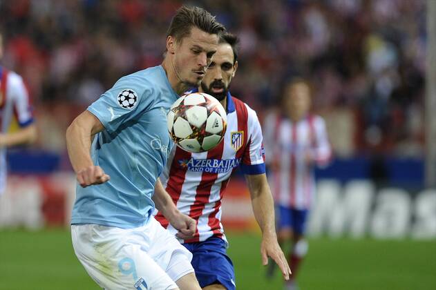 Atletico de Madrid Defender, Juan Francisco Torres Belen - JUANFRAN, number 20 . Malmo FF Forward, Markus Rosenberg - MARKUS ROSENBERG, number 9. Round 3 of the CHAMPIONS league, soccer match between Atletico de Madrid - Malmo FF at the Vicente Calderon estadium, Madrid - Spain by October 22, 2014. PHOTO: MIguelLopez. 