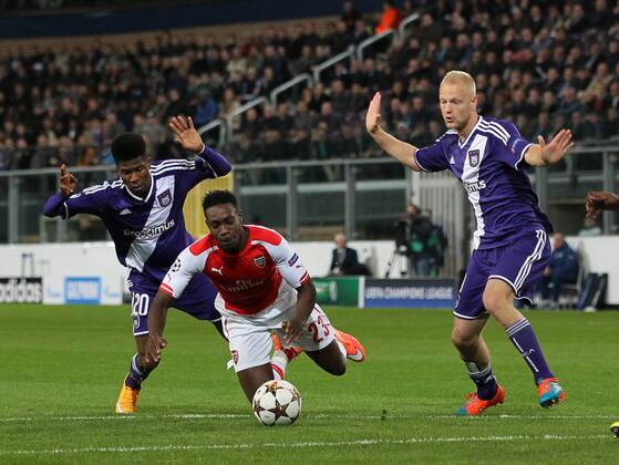 Anderlecht s Ibrahima Conte fouls Arsenal s Danny Welbeck - UEFA Champions League - RSC Anderlecht vs Arsenal - Constant Vanden Stock Stadium - Belgium - 22nd October 2014 - Picture David Klein Sportimage EDITORIAL USE ONLY. No use with unauthorised audio, video, data, fixture lists, club league logos or live services. Online in-match use limited to 120 images, no video emulation. No use in betting, games or single club league player publications.