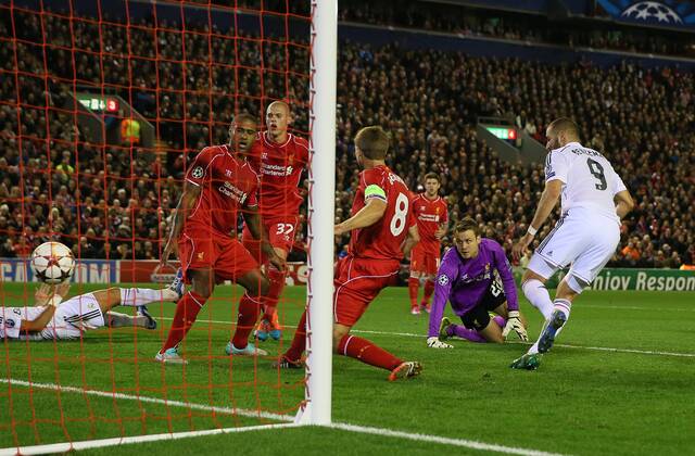 Simon Mignolet of Liverpool looks on as Karim Benzema of Real Madrid scores the third goal - UEFA Champions League Group B - Liverpool vs Real Madrid - Anfield Stadium - Liverpool- England - 22nd October 2014 - Picture Simon Bellis Sportimage EDITORIAL USE ONLY. No use with unauthorised audio, video, data, fixture lists, club league logos or live services. Online in-match use limited to 120 images, no video emulation. No use in betting, games or single club league player publications.