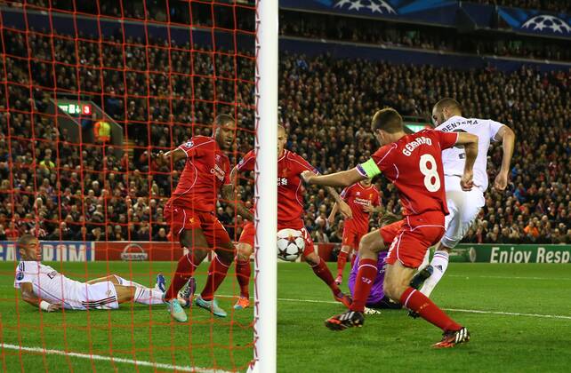 Karim Benzema of Real Madrid scores the third goal his second of the night - UEFA Champions League Group B - Liverpool vs Real Madrid - Anfield Stadium - Liverpool- England - 22nd October 2014 - Picture Simon Bellis Sportimage EDITORIAL USE ONLY. No use with unauthorised audio, video, data, fixture lists, club league logos or live services. Online in-match use limited to 120 images, no video emulation. No use in betting, games or single club league player publications.