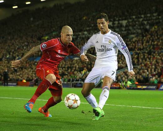 Cristiano Ronaldo of Real Madrid gets a cross past Martin Skrtel of Liverpool - UEFA Champions League Group B - Liverpool vs Real Madrid - Anfield Stadium - Liverpool- England - 22nd October 2014 - Picture Simon Bellis Sportimage EDITORIAL USE ONLY. No use with unauthorised audio, video, data, fixture lists, club league logos or live services. Online in-match use limited to 120 images, no video emulation. No use in betting, games or single club league player publications.