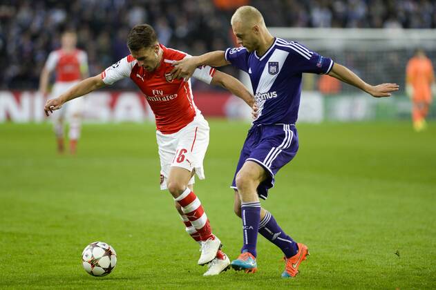 - BRUSSELS, BELGIUM: Arsenal s Aaron Ramsey and Anderlecht s Olivier Deschacht fight for the ball during a third group stage game between RSCA Anderlecht and English team Arsenal, in the group D of the UEFA Champions League competition, Wednesday 22 October 2014. LAURIExDIEFFEMBACQ  premiumd 20145131