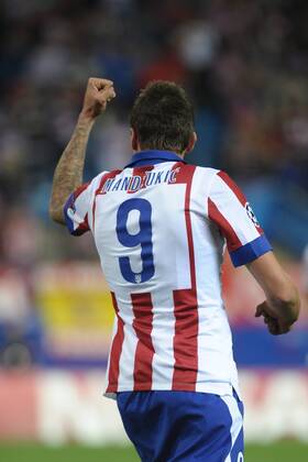 Atletico de Madrid Forward, Mario Mandzukic - MANDZUKIC, number 9 celebrates after scoring a goal (2,0). Round 3 of the CHAMPIONS league, soccer match between Atletico de Madrid - Malmo FF at the Vicente Calderon estadium, Madrid - Spain by October 22, 2014. PHOTO: MIguelLopez. 