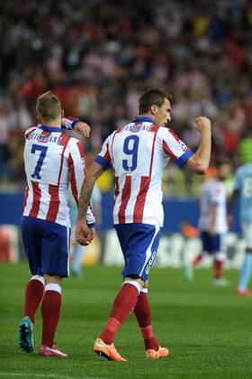 Atletico de Madrid Forward, Mario Mandzukic - MANDZUKIC, number 9 celebrates after scoring a goal (2,0). Atletico de Madrid Forward, Antoine Griezmann - GRIEZMANN, number 7. Round 3 of the CHAMPIONS league, soccer match between Atletico de Madrid - Malmo FF at the Vicente Calderon estadium, Madrid - Spain by October 22, 2014. PHOTO: MIguelLopez. 