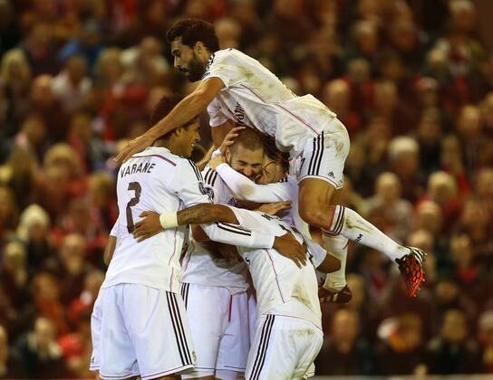 Karim Benzema of Real Madrid celebrates scoring the second goal - UEFA Champions League Group B - Liverpool vs Real Madrid - Anfield Stadium - Liverpool- England - 22nd October 2014 - Picture Simon Bellis Sportimage EDITORIAL USE ONLY. No use with unauthorised audio, video, data, fixture lists, club league logos or live services. Online in-match use limited to 120 images, no video emulation. No use in betting, games or single club league player publications.