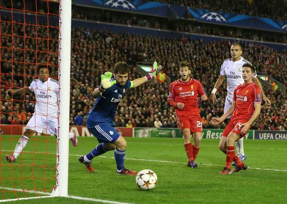 Iker Casillas of Real Madrid watches the ball out as Adam Lallana and Joe Allen of Liverpool fail to score - UEFA Champions League Group B - Liverpool vs Real Madrid - Anfield Stadium - Liverpool- England - 22nd October 2014 - Picture Simon Bellis Sportimage EDITORIAL USE ONLY. No use with unauthorised audio, video, data, fixture lists, club league logos or live services. Online in-match use limited to 120 images, no video emulation. No use in betting, games or single club league player publications.