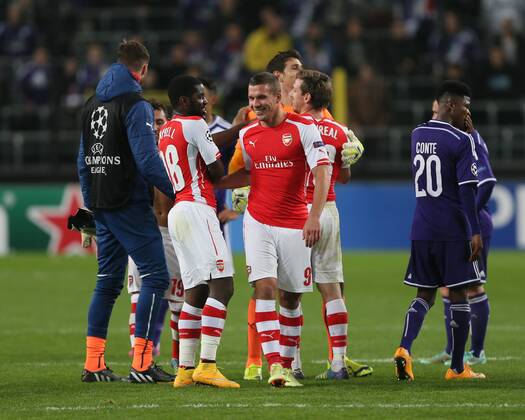 Arsenal s Lukas Podolski celebrates scoring his sides second goal at the final whistle - UEFA Champions League - RSC Anderlecht vs Arsenal - Constant Vanden Stock Stadium - Belgium - 22nd October 2014 - Picture David Klein Sportimage EDITORIAL USE ONLY. No use with unauthorised audio, video, data, fixture lists, club league logos or live services. Online in-match use limited to 120 images, no video emulation. No use in betting, games or single club league player publications.