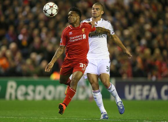 Raheem Sterling of Liverpool tussles with Pepe of Real Madrid - UEFA Champions League Group B - Liverpool vs Real Madrid - Anfield Stadium - Liverpool- England - 22nd October 2014 - Picture Simon Bellis Sportimage EDITORIAL USE ONLY. No use with unauthorised audio, video, data, fixture lists, club league logos or live services. Online in-match use limited to 120 images, no video emulation. No use in betting, games or single club league player publications.