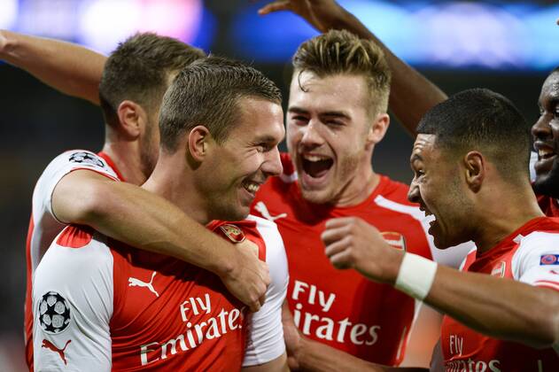 - BRUSSELS, BELGIUM: Arsenal s Lukas Podolski (C L) celebrates with his teammates after scoring during a third group stage game between RSCA Anderlecht and English team Arsenal, in the group D of the UEFA Champions League competition, Wednesday 22 October 2014. LAURIExDIEFFEMBACQ  premiumd 20145321