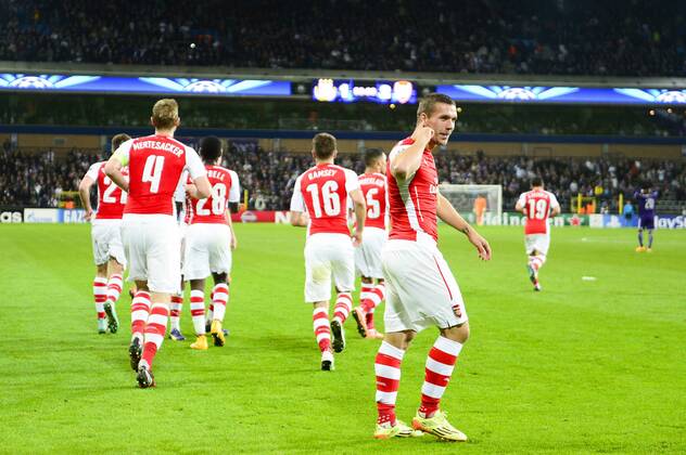 - BRUSSELS, BELGIUM: Arsenal s Lukas Podolski (front) celebrates with his teammates after scoring during a third group stage game between RSCA Anderlecht and English team Arsenal, in the group D of the UEFA Champions League competition, Wednesday 22 October 2014. LAURIExDIEFFEMBACQ  premiumd 20145322