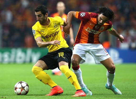 UEFA Champions League Group D match between Galatasaray and Borussia Dortmund at Turk Telekom Arena on October 22, 2014 in Istanbul, Turkey. Score: Galatasaray 0 - Borussio Dortmund 4 Pictured: Selcuk Inan of Galatasaray and Henrikh Mkhitaryan of Borussia Dortmund. 