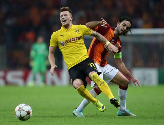UEFA Champions League Group D match between Galatasaray and Borussia Dortmund at Turk Telekom Arena on October 22, 2014 in Istanbul, Turkey. Score: Galatasaray 0 - Borussio Dortmund 4 Pictured: Selcuk Inan of Galatasaray and Marco Reus of Borussia Dortmund. 