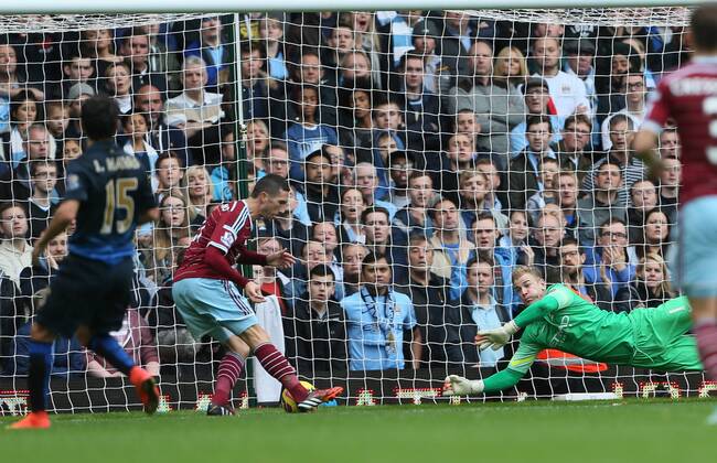 West Ham s Morgan Amalfintano scoring his sides opening goal Barclays Premier League - West Ham United vs Manchester City - Upton Park - England - 25th October 2014 - Picture David Klein Sportimage EDITORIAL USE ONLY. No use with unauthorised audio, video, data, fixture lists, club league logos or live services. Online in-match use limited to 120 images, no video emulation. No use in betting, games or single club league player publications.
