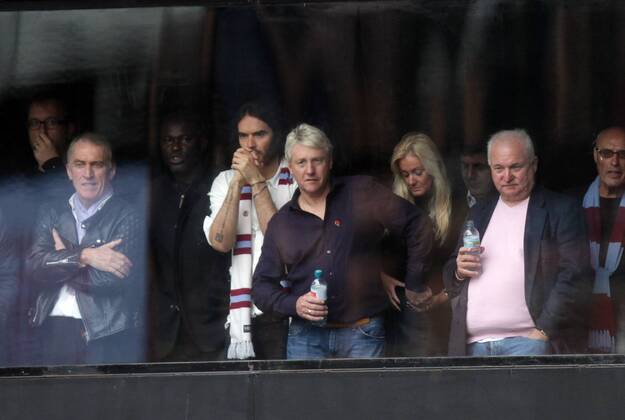 West Ham United v Manchester City . . London, UK . . 25.10.2014 Comedian Russell Brand watches his team West Ham United beside former player Frank McAvennie.