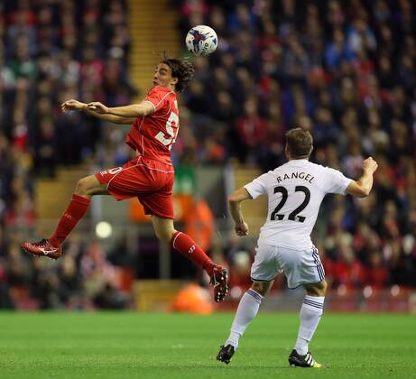 Liverpool s Lazer Markovic tussles with Swansea s Angel Rangel League Cup Fourth Round- Liverpool vs Swansea City - Anfield - England - 28th October 2014 - Picture David Klein Sportimage EDITORIAL USE ONLY. No use with unauthorised audio, video, data, fixture lists, club league logos or live services. Online in-match use limited to 120 images, no video emulation. No use in betting, games or single club league player publications.