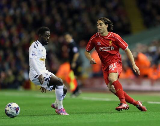 Liverpool s Lazer Markovic tussles with Swansea s Nathan Dyer League Cup Fourth Round- Liverpool vs Swansea City - Anfield - England - 28th October 2014 - Picture David Klein Sportimage EDITORIAL USE ONLY. No use with unauthorised audio, video, data, fixture lists, club league logos or live services. Online in-match use limited to 120 images, no video emulation. No use in betting, games or single club league player publications.