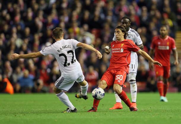 Liverpool s Lazer Markovic tussles with Swansea s Angel Rangel League Cup Fourth Round- Liverpool vs Swansea City - Anfield - England - 28th October 2014 - Picture David Klein Sportimage EDITORIAL USE ONLY. No use with unauthorised audio, video, data, fixture lists, club league logos or live services. Online in-match use limited to 120 images, no video emulation. No use in betting, games or single club league player publications.
