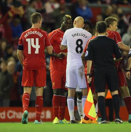 Liverpool s Mario Balotelli argues with Swansea s Jonjo Shelvey at the final whistle League Cup Fourth Round- Liverpool vs Swansea City - Anfield - England - 28th October 2014 - Picture David Klein Sportimage EDITORIAL USE ONLY. No use with unauthorised audio, video, data, fixture lists, club league logos or live services. Online in-match use limited to 120 images, no video emulation. No use in betting, games or single club league player publications.