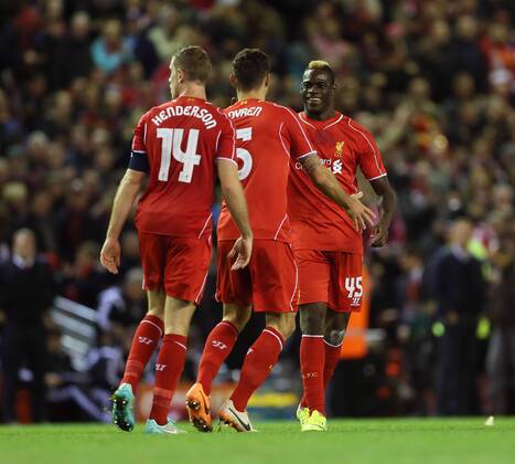 Liverpool s Mario Balotelli celebrates with goalscorer Dejan Lovren League Cup Fourth Round- Liverpool vs Swansea City - Anfield - England - 28th October 2014 - Picture David Klein Sportimage EDITORIAL USE ONLY. No use with unauthorised audio, video, data, fixture lists, club league logos or live services. Online in-match use limited to 120 images, no video emulation. No use in betting, games or single club league player publications.
